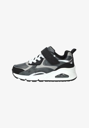 Scarpa sportiva nera e grigia, con tomaia in materiale sintetico texturizzato, lacci bianchi, cinturino in velcro e ammortizzazione ad aria visibile nella suola.