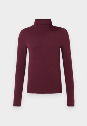 Bordo majica z dolgimi rokavi in visokim ovratnikom, izdelana iz mehke, lahke tkanine s prilagojeno zasnovo brez vzorcev ali vidne opreme.