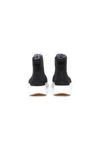 Black suede ankle boots with white soles, featuring a textured finish and a soft inner lining, rounded toe, and minimalistic design.