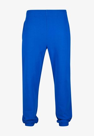 Blauwe sweatpants van zacht materiaal met een relaxte pasvorm, voorzien van een elastische tailleband en boorden bij de enkels. Geen zichtbare zakken.