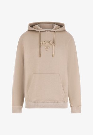 Beżowa bluza z kapturem, kieszenią z przodu, sznurkami oraz wypukłym logo „GUESS” nad małym trójkątnym emblematem na piersi.