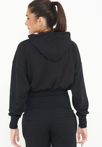 LEGEA TRIXY - Felpa con zip - nero