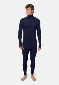 Marineblaue thermische Basisschicht-Set mit einem Zip-up-Mockneck-Oberteil mit langen Ärmeln und passenden enganliegenden Leggings. Glattes, dehnbares Material.