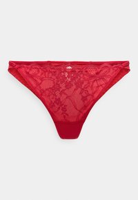 Κόκκινο στρινγκ από δαντέλα με ανθικά σχέδια, λεία πίσω όψη και περίτεχνα διακοσμητικά στη μέση. Φτιαγμένο από απαλό, ελαφρύ ύφασμα.