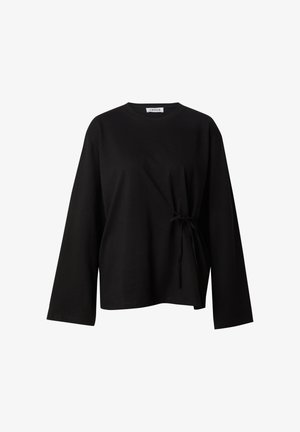 Schwarzes Langarmoberteil aus weicher Baumwolle, mit einem runden Ausschnitt und gebundenem Detail an der Seite für einen taillierten Effekt. Lässige Passform.
