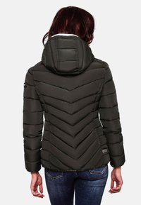 Dark olive green insulated jacket with chevron stitching, a hood, and long sleeves. Textured fabric and a small logo on the left sleeve.