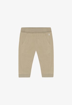 Beige katoenen joggingbroek met elastische tailleband en zijzakken. Heeft getextureerde knie-accenten en geribbelde enkelboorden.