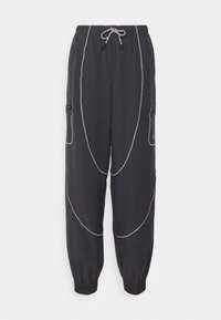 Zwarte sweatpants met een ontspannen pasvorm, elastische tailleband, trekkoord, zijritsen en contrasterende witte stiksels en accenten.