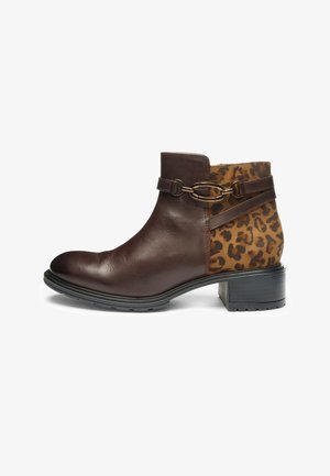 Brown leather ankle boot with leopard print side panel, decorative strap and gold-tone hardware, and a low block heel.