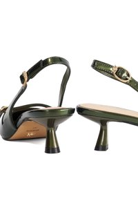 Green patent leather sandals with a slim heel, open toe, and an ankle strap featuring a gold buckle. Smooth texture and sleek design.