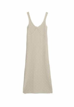 Beige gebreide mouwloze midi-jurk met geschulpte randen en een gestructureerd patroon.