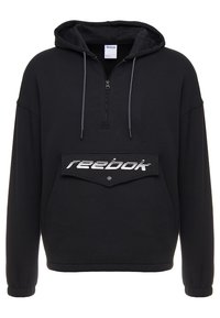 Svart huvtröja med kvartdragkedja, framfickan har "Reebok"-logotyp, dragsko och ribbade ärmslut. Mjuk tygstruktur.