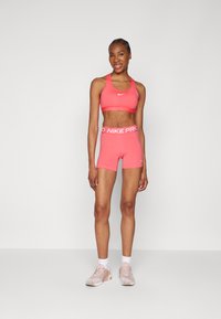 Nike Performance BRA - Sujetadores deportivos con sujeción media - aster pink/white