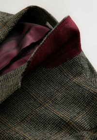 Green and brown checkered wool jacket with burgundy velvet collar and matching burgundy herringbone pattern lining.