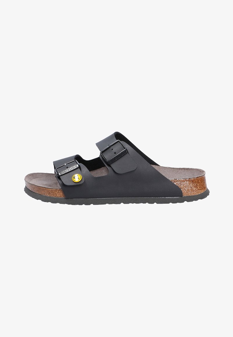 Black EVA slip-on sandal with two adjustable straps, cork footbed, and rubber sole, featuring a yellow logo detail on the buckle.