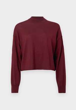 Burgundy cropped pullover with long sleeves, high neck, and a soft texture. Simple design with no visible logos or patterns.