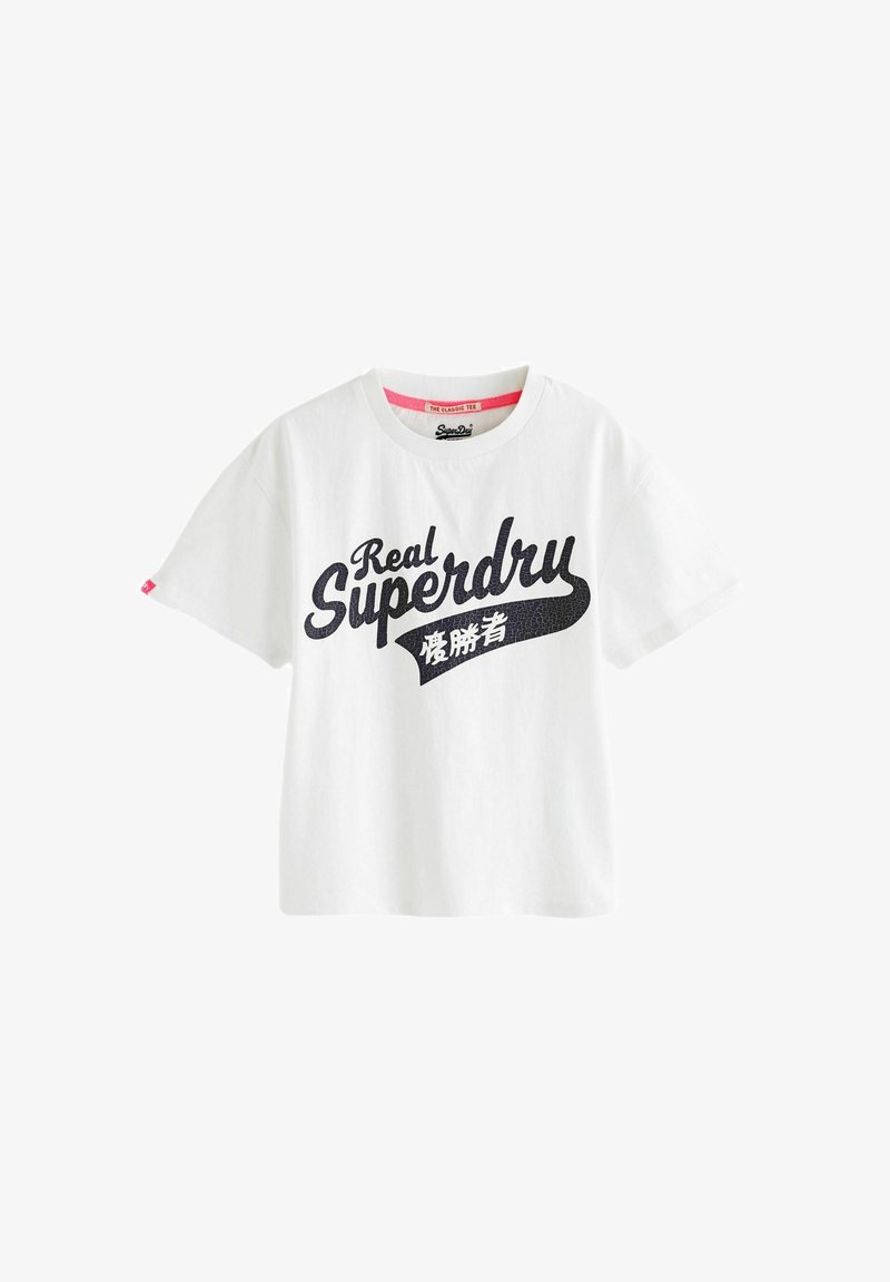 White cotton t-shirt with short sleeves, featuring a large black print logo saying "Real Superdry" and a small pink tag on the left sleeve.