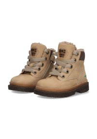 Botas de tobillo de cuero marrón claro con forro de piel de oveja, punta redonda, suela de goma, cordones beige, cremallera lateral y parche de logo hexagonal. Dispositivo para uso casual.