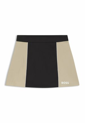 Schwarzer und beigefarbener Rock mit einem Farbblock-Design, einem engen Bund, Nahtdetails und einem weißen Logo unten rechts.