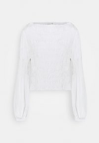 Blouse blanche avec une texture froncée, manches longues et un large décolleté. Caractérisée par un tissu froncé et des manches amples pour plus de volume.