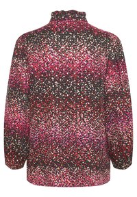 Långärmad svart topp med hög hals, prydd med ett livligt prickigt mönster i rosa, rött och vitt över tyget.