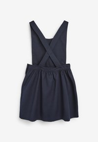 Mörkblå klänning med korsade band, rynkad kjol och en sömlös midja. Tillverkad av ett mjukt, texturerat tyg för komfort.