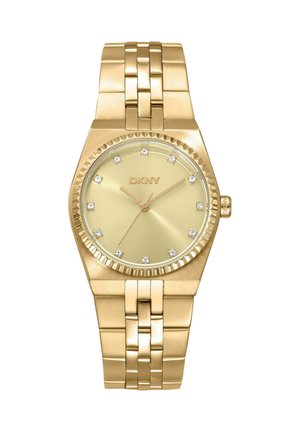 Gold-tone DKNY wristwatch with metal link band, round dial, crystal hour markers, and three slim hands showing time.