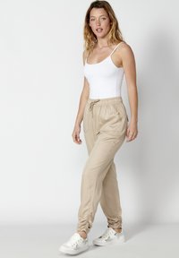 Koroshi LONG JOGGING  - Traperice suženog kroja - beige