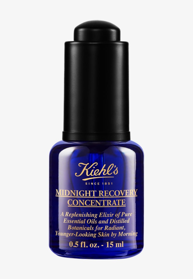 Botella de vidrio azul de Kiehl's Midnight Recovery Concentrate con tapa gotero negra, que contiene 15 ml de suero para la piel, para una piel radiante y de aspecto más joven.