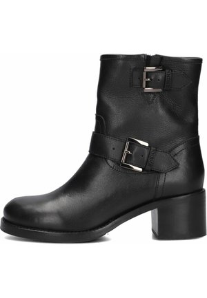 Black leather ankle boot featuring a block heel, two side buckles, and a smooth texture. Zipper closure at the back for easy wear.