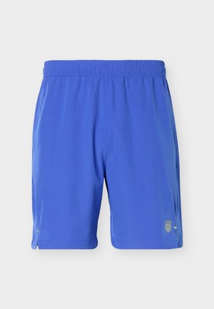 Pantalones cortos deportivos azules con cintura elástica y pequeño logo en la parte inferior derecha, mostrados sobre un fondo claro y liso.