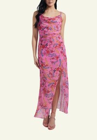Pink floral maxi dress with spaghetti straps, featuring a cowl neckline and side slit, crafted from lightweight, textured fabric.