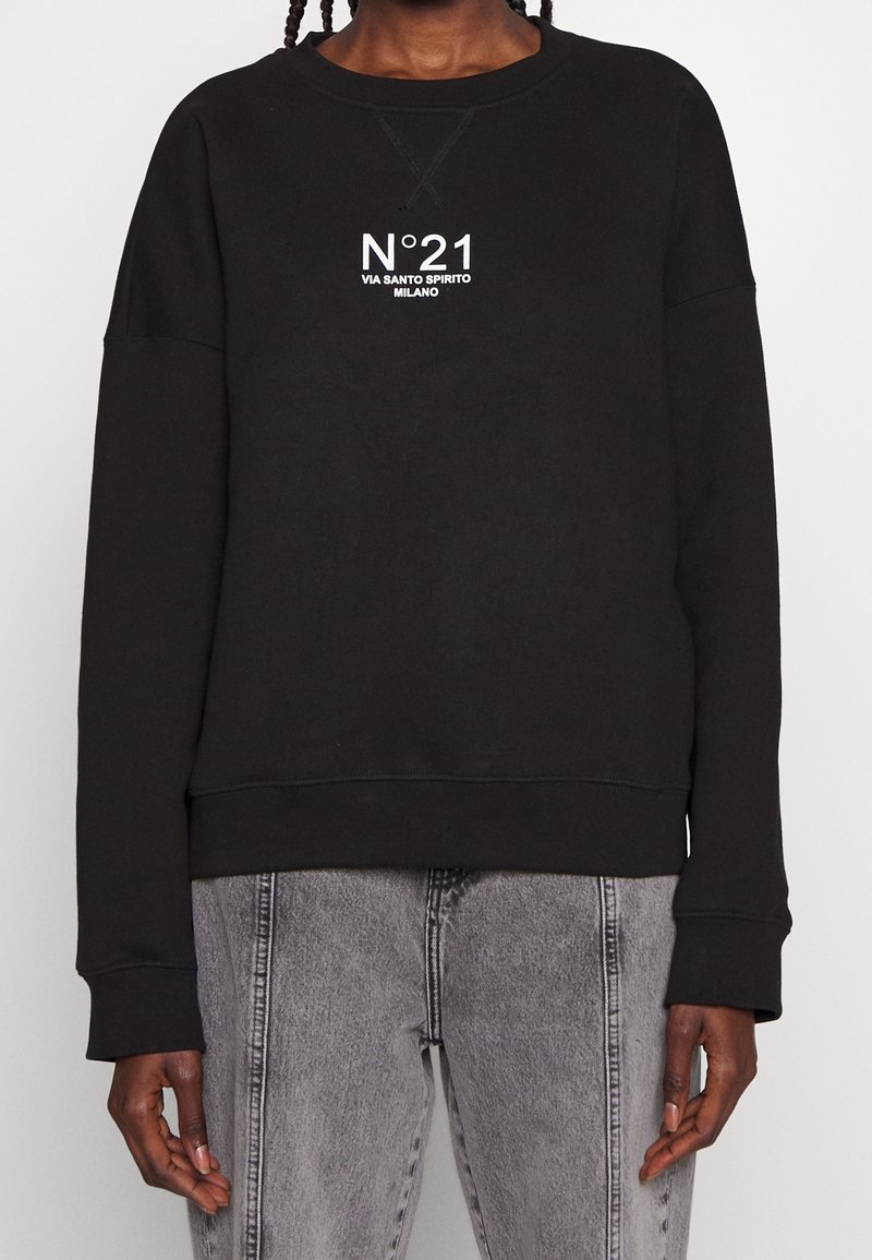 Black sweatshirt made of cotton, featuring a crew neckline, long sleeves, and a white graphic print in the center and small logo detail.