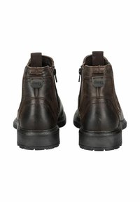 Botas de tobillo de cuero marrón oscuro con cierre de cremallera, suela de goma negra resistente y marca Jeep en la parte trasera. Acabado texturizado con detalles cosidos.