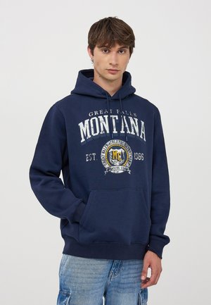 Felpa blu navy in misto cotone. Presenta una tasca frontale, cappuccio con coulisse e una stampa grafica di "Montana" con un emblema.
