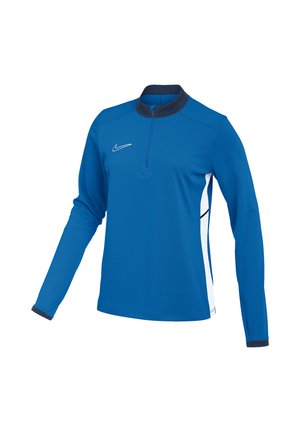 Pull-over de sport bleu à manches longues avec demi-fermeture éclair, col et poignets noirs, panneaux latéraux blancs et logo Nike swoosh blanc sur la poitrine.