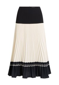 Pleated midi skirt featuring a black top section, cream pleats, and a black ruffled hem with a logo band. Zipper closure at the back.