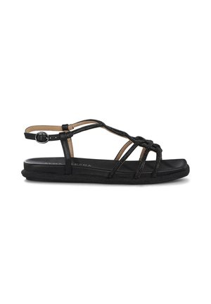 Sandalias negras con tiras trenzadas, suela plana y hebilla ajustable en el tobillo. El material parece suave con una plantilla texturizada para mayor comodidad.