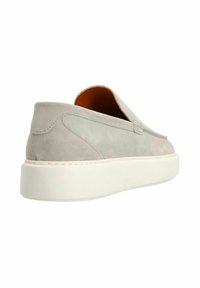 Grey suede slip-on shoe with a white rubber sole. Rounded toe and minimalistic design. Features stitching accents along the upper.