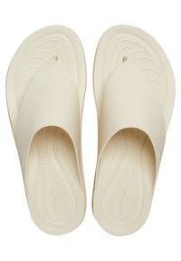 Infradito beige chiaro con una finitura liscia e lucida. Presentano un design con una fascia larga e una soletta testurizzata per il massimo comfort.