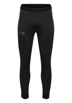 Sorte slim-fit sportbukser med lynlåslommer på siden og "hummel" logo på venstre lår, elastisk talje og lynlåse ved anklerne.