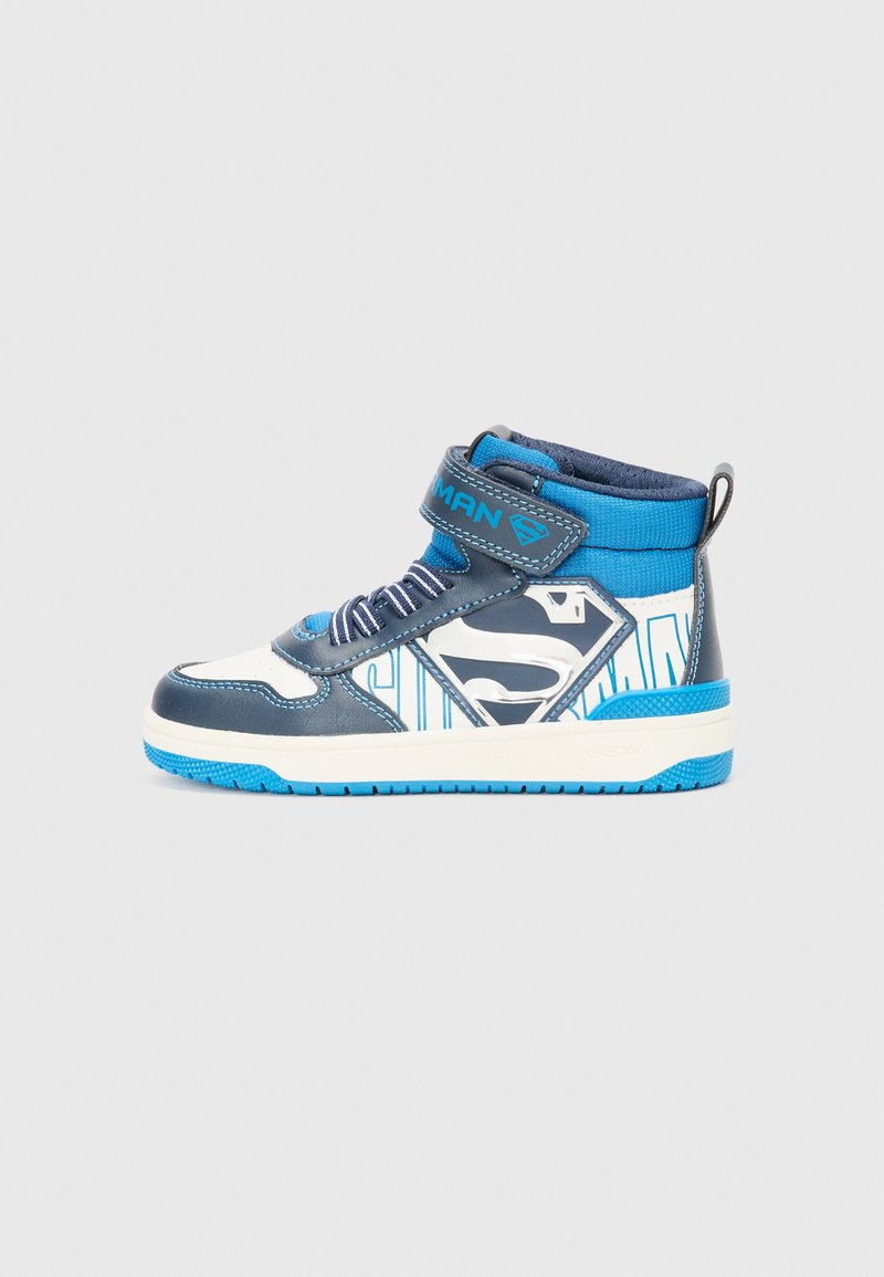 Blue and gray high-top sneakers with white accents, featuring a Velcro strap, textured materials, and a prominent superhero logo on the side.
