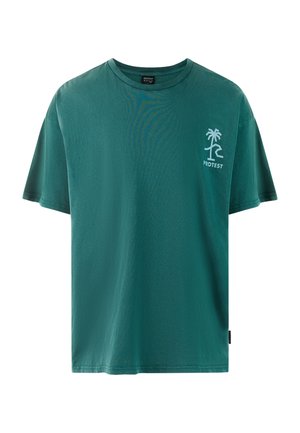 Green cotton t-shirt with short sleeves. Features a small white palm tree logo on the left chest and a tag on the side. Soft texture.