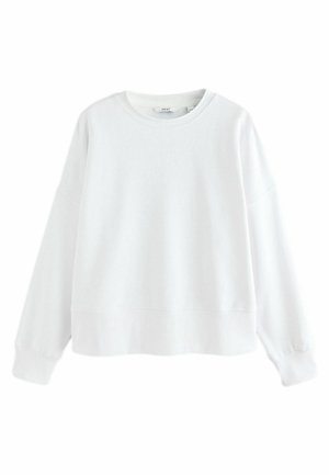 Sweat-shirt blanc uni à manches longues avec col rond, poignets et bas côtelés, présenté sur fond blanc.