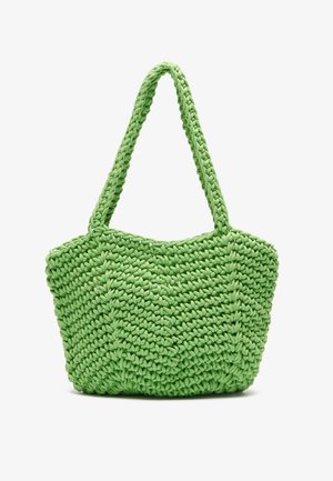 Sac à main tissé vert avec une surface texturée, présentant deux poignées tressées et un corps arrondi et spacieux.