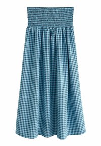 Jupe en coton à carreaux bleus avec une taille smockée, un design fluide et une coupe mi-cuisse. Présente un motif en grille dans des nuances de bleu variées.