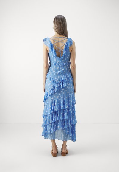 Blue, tiered maxi dress made of lightweight fabric with white floral patterns. Features ruffled sleeves and a crisscross back design.