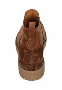 Brown suede ankle boot with a textured finish, rubber sole, and a prominent heel tab. Features stitched accents and a branded label.