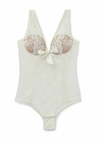 Lace bodysuit in crème met doorschijnende bloemendetails, een diepe halslijn, verstelbare bandjes en een strikaccent aan de voorkant in het midden. Drukknoopsluiting aan de onderkant.