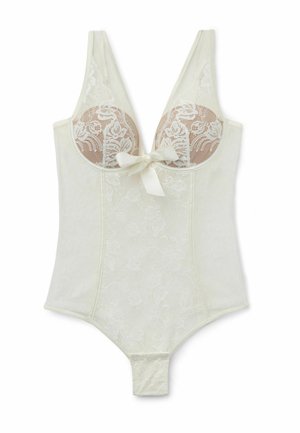 Lace bodysuit in cream with sheer floral detailing, plunge neckline, adjustable straps, and a bow accent at the center front. Button closure at the bottom.
